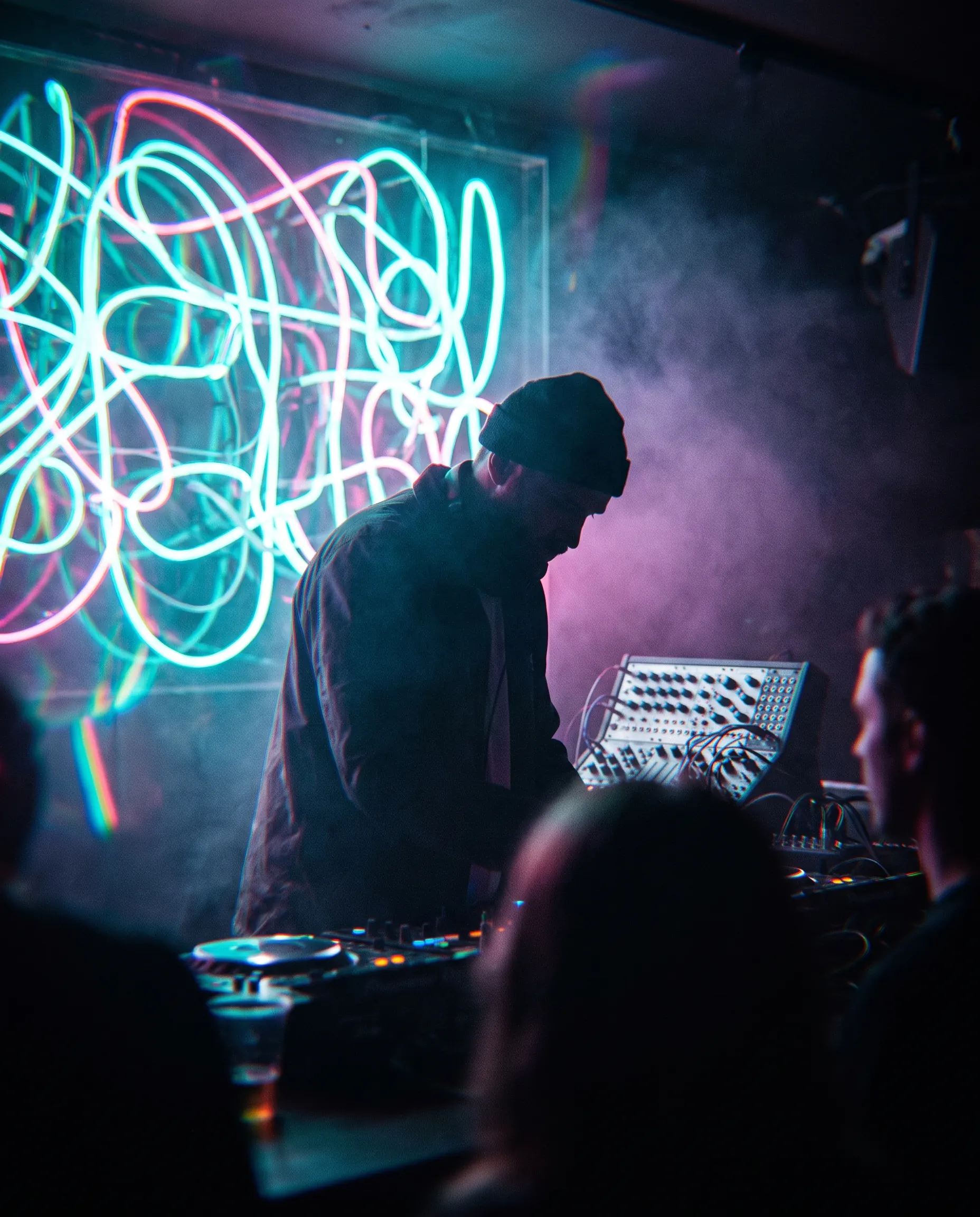 Producer silhouette against neon tube lights