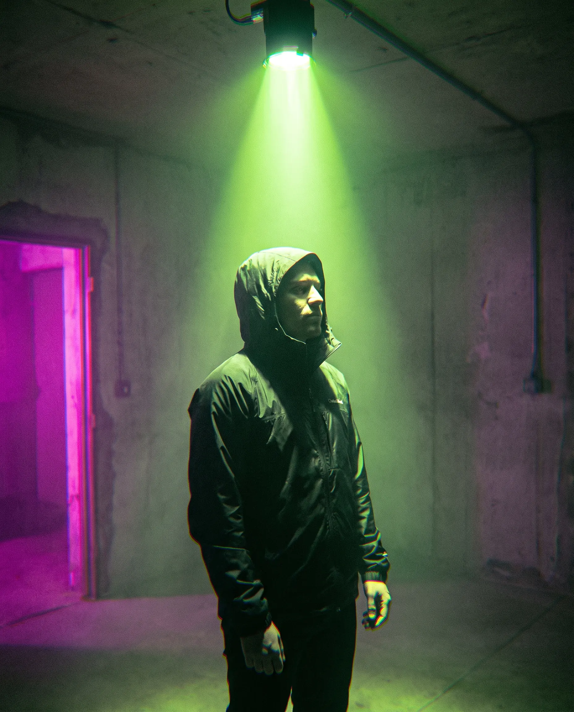 Performer under acid-green spotlight